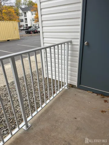 a view of a porch with wooden floor
