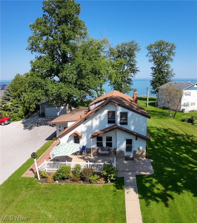 Front view of Clean White Lake Erie Beach House. Parked in the center of 1.38 acre allows for plenty of space for gatherings and activities.