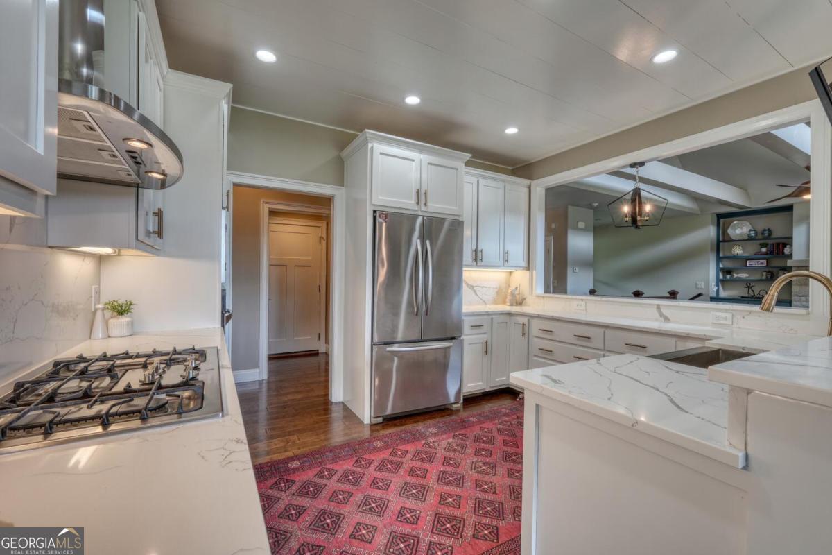 583 Fleenor Road, Unit TR 1 2 3 Blairsville, GA 30512 - Photo 35 of 99 a kitchen with stainless steel appliances granite countertop a refrigerator and a sink