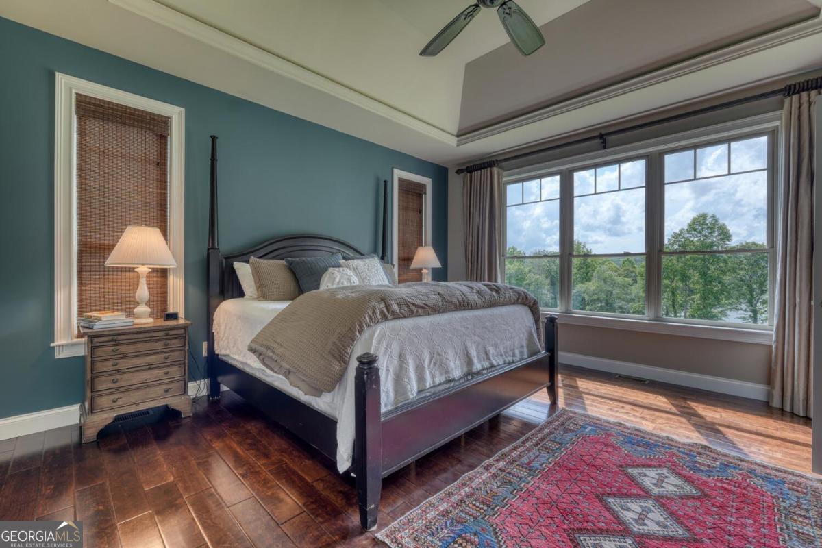 583 Fleenor Road, Unit TR 1 2 3 Blairsville, GA 30512 - Photo 40 of 99 a bedroom with a bed lamp and a large window