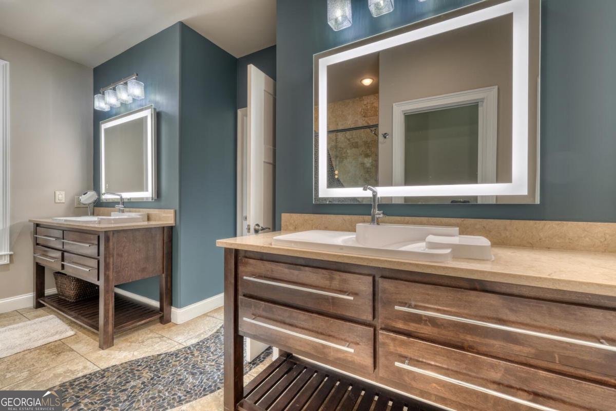 583 Fleenor Road, Unit TR 1 2 3 Blairsville, GA 30512 - Photo 46 of 99 a bathroom with a sink and a mirror