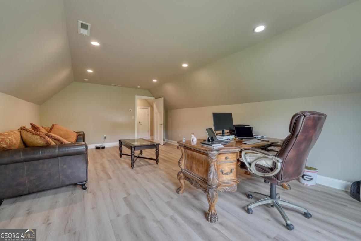 583 Fleenor Road, Unit TR 1 2 3 Blairsville, GA 30512 - Photo 53 of 99 a workspace with furniture and wooden floor