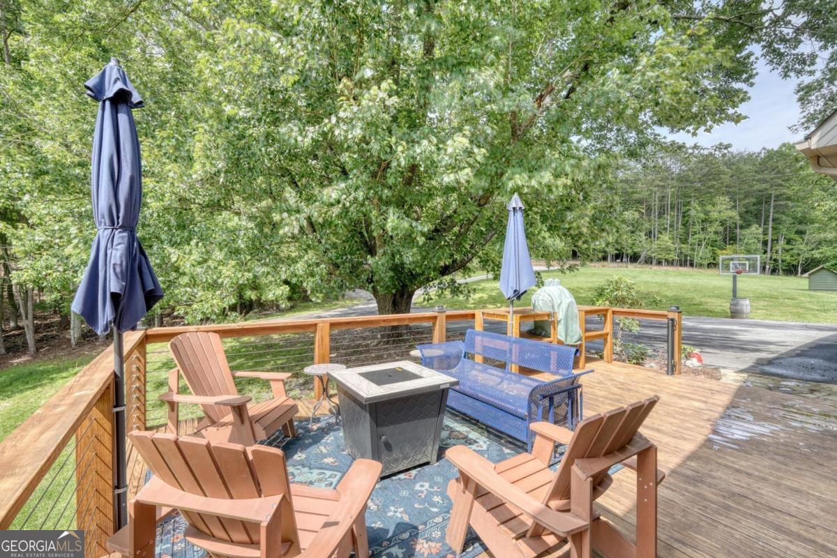 583 Fleenor Road, Unit TR 1 2 3 Blairsville, GA 30512 - Photo 71 of 99 a view of an outdoor sitting area with furniture and wooden deck