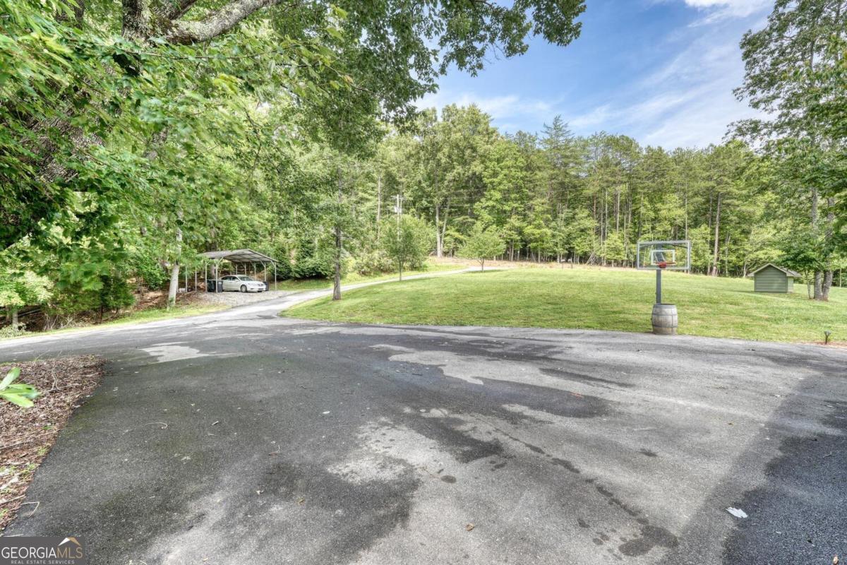 583 Fleenor Road, Unit TR 1 2 3 Blairsville, GA 30512 - Photo 72 of 99 a view of a house with a yard and a street