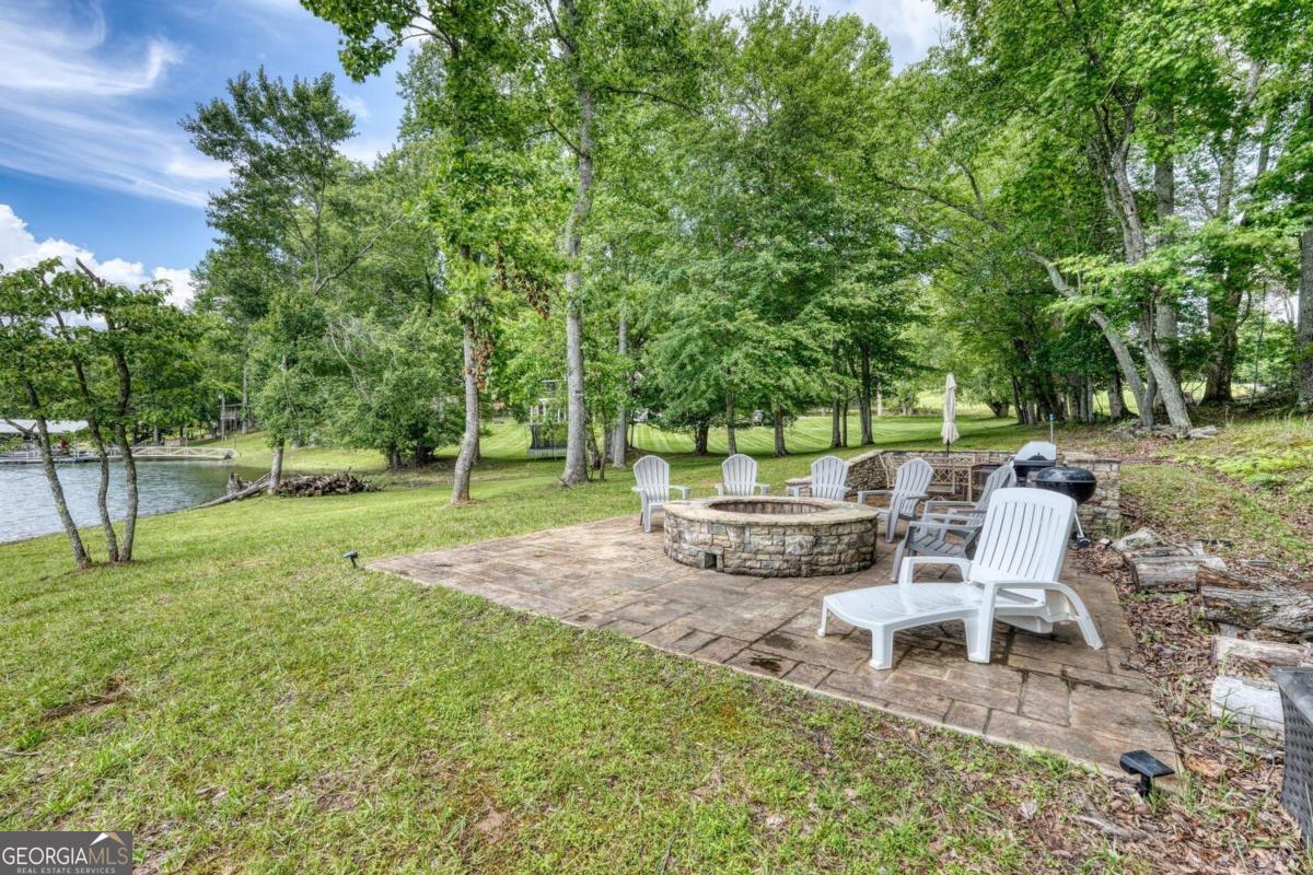 583 Fleenor Road, Unit TR 1 2 3 Blairsville, GA 30512 - Photo 81 of 99 a view of a chair and table of the garden