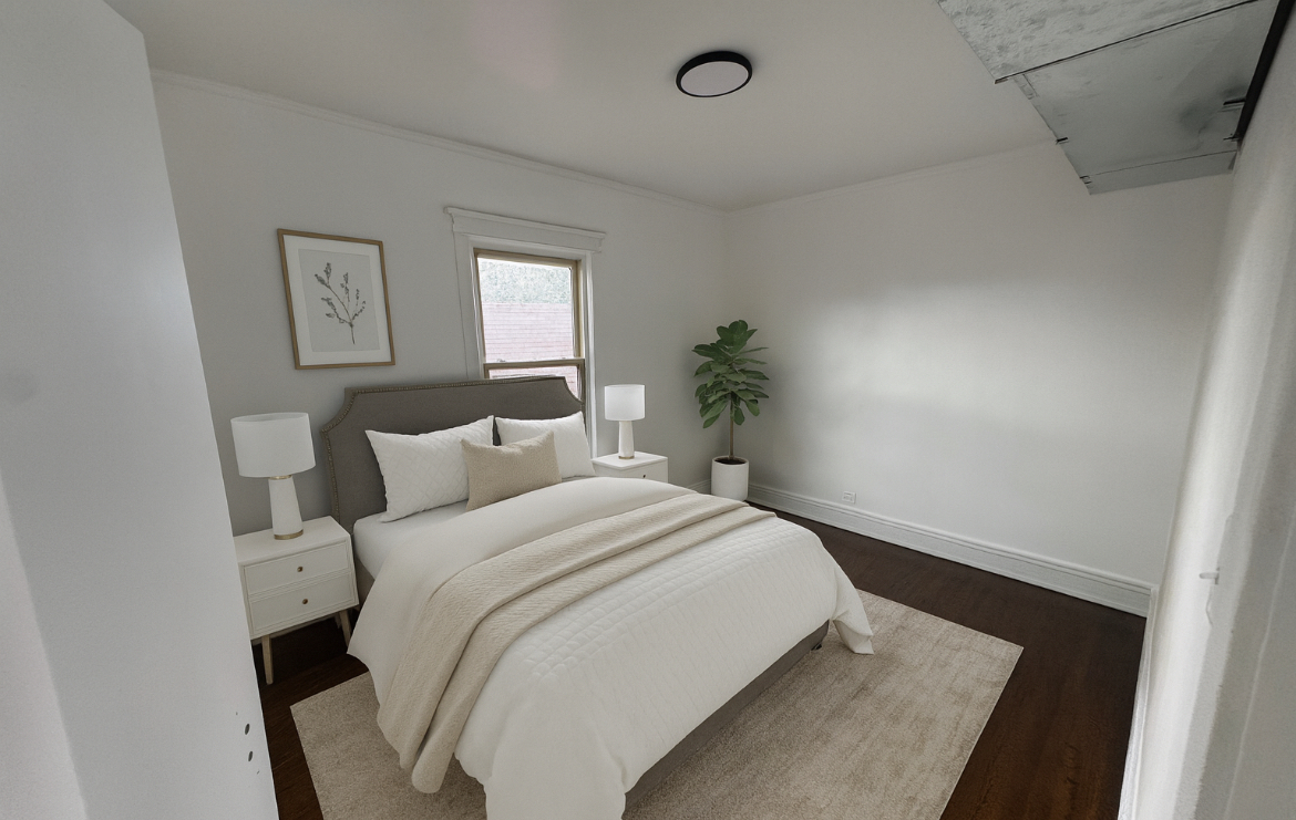 7955 South Elizabeth Street, Unit 2 Chicago, IL 60620 - Photo 3 of 10 a bedroom with a bed and painting on the wall