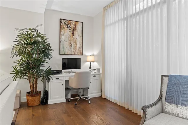 a bedroom with bed and window