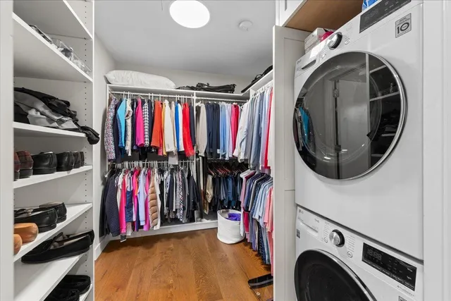 a spacious bathroom with a granite countertop sink and a mirror