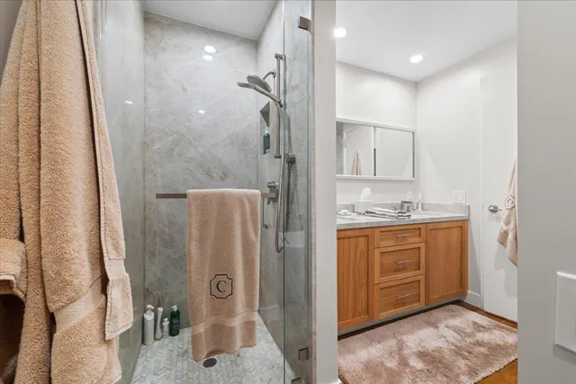 a bathroom with a tub sink and a mirror