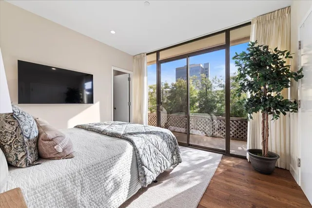 a bathroom with a granite countertop toilet a sink and shower