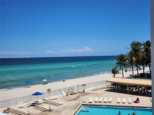 a view of a swimming pool and an outdoor space