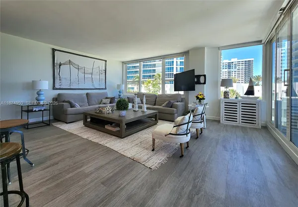 a living room with furniture and a large window