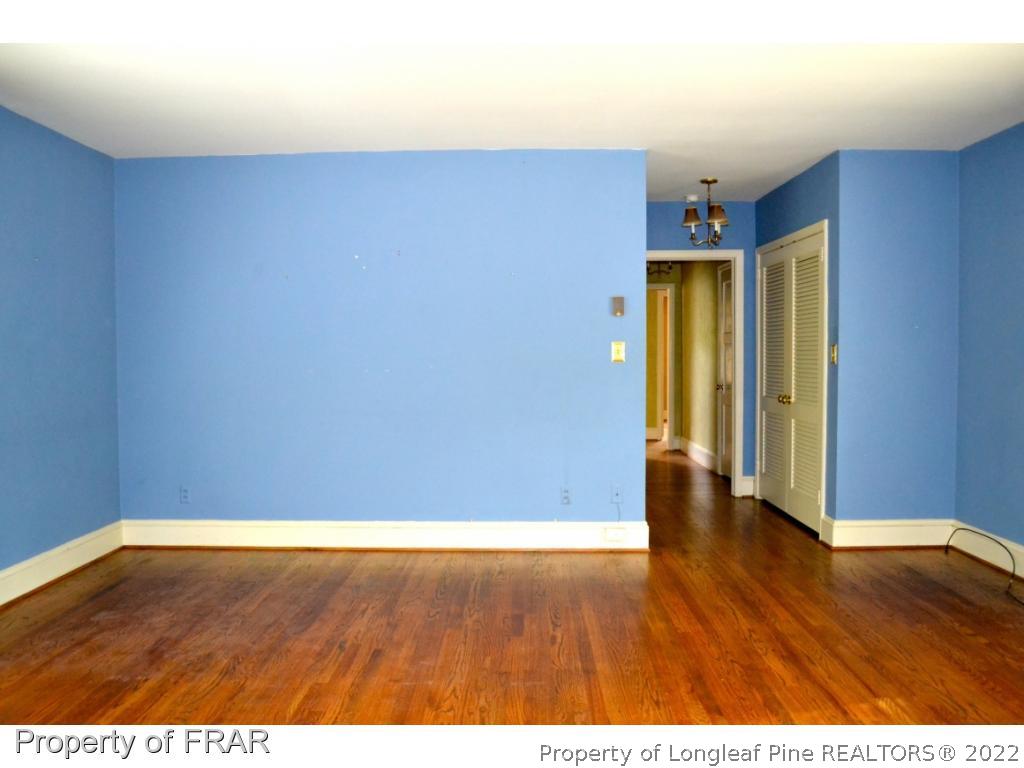 606 Rush Road Fayetteville, NC 28305 - Photo 17 of 22 a view of an empty room with wooden floor