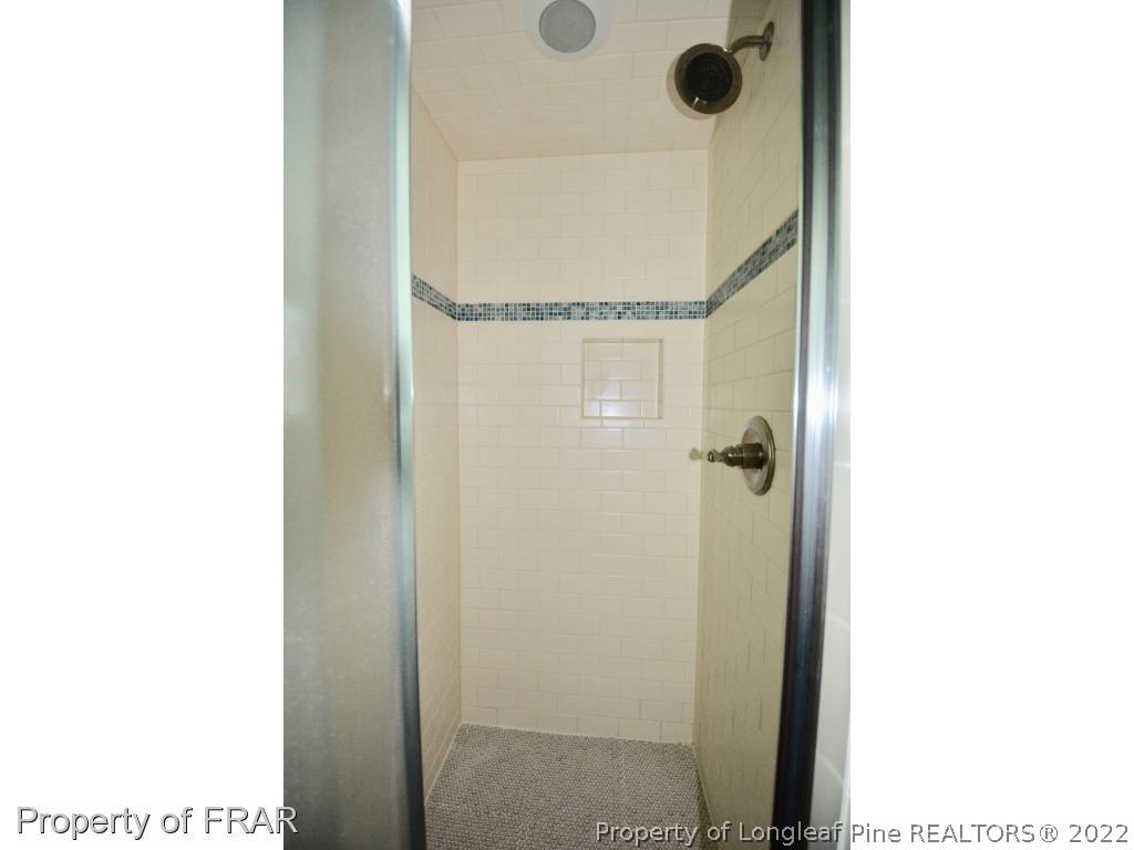 606 Rush Road Fayetteville, NC 28305 - Photo 20 of 22 a picture of a bathroom with a shower