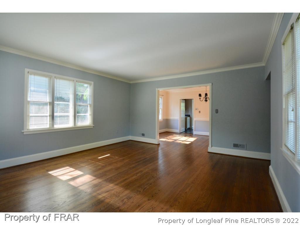 606 Rush Road Fayetteville, NC 28305 - Photo 4 of 22 a view of empty room with wooden floor and fan