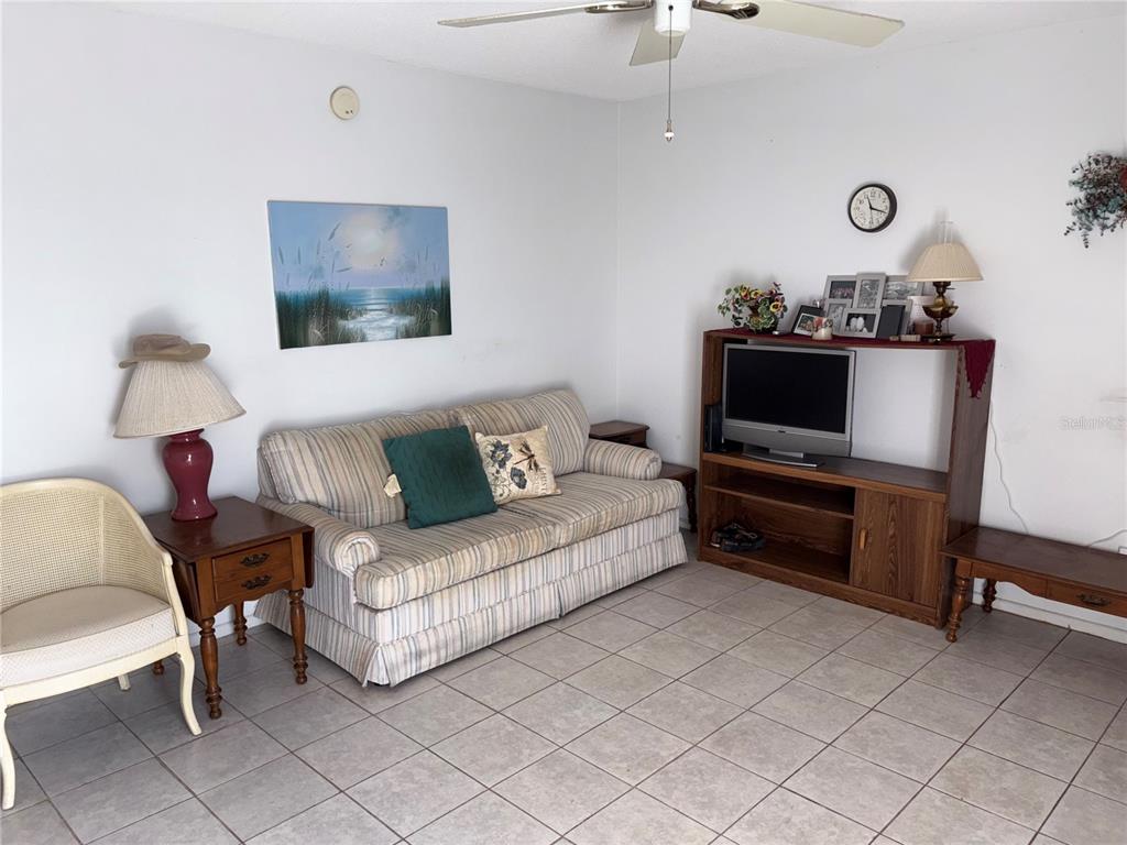 250 Rosery Road Northwest, Unit 328 Largo, FL 33770 - Photo 2 of 17 a living room with furniture