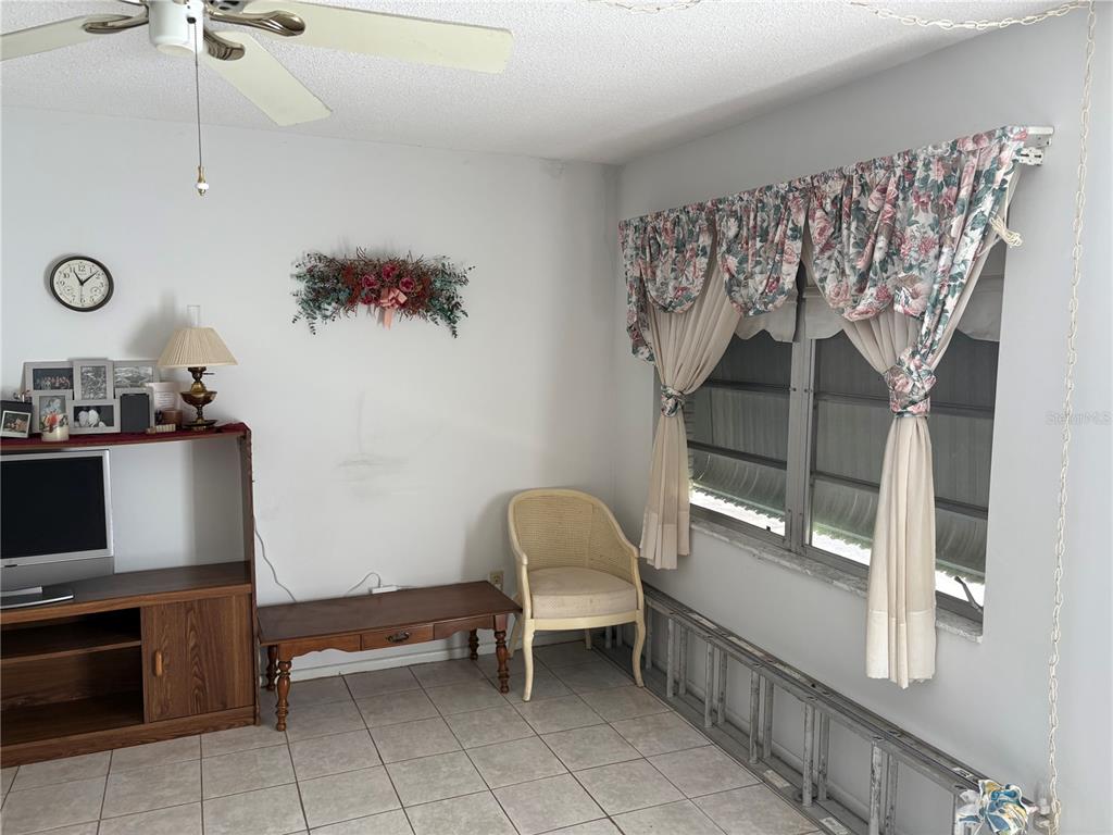 250 Rosery Road Northwest, Unit 328 Largo, FL 33770 - Photo 3 of 17 a room with a table and chairs
