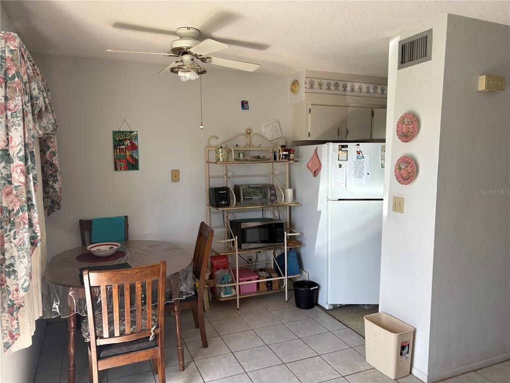 250 Rosery Road Northwest, Unit 328 Largo, FL 33770 - Photo 4 of 17 a room with furniture a washer and dryer