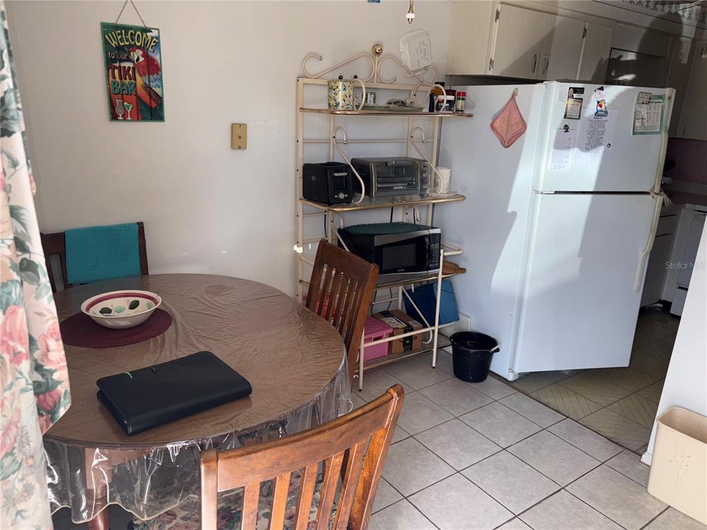 250 Rosery Road Northwest, Unit 328 Largo, FL 33770 - Photo 7 of 17 a view of living room with furniture and a fireplace