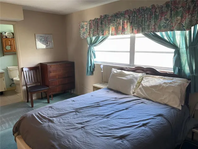 a bathroom with a sink a mirror and toilet