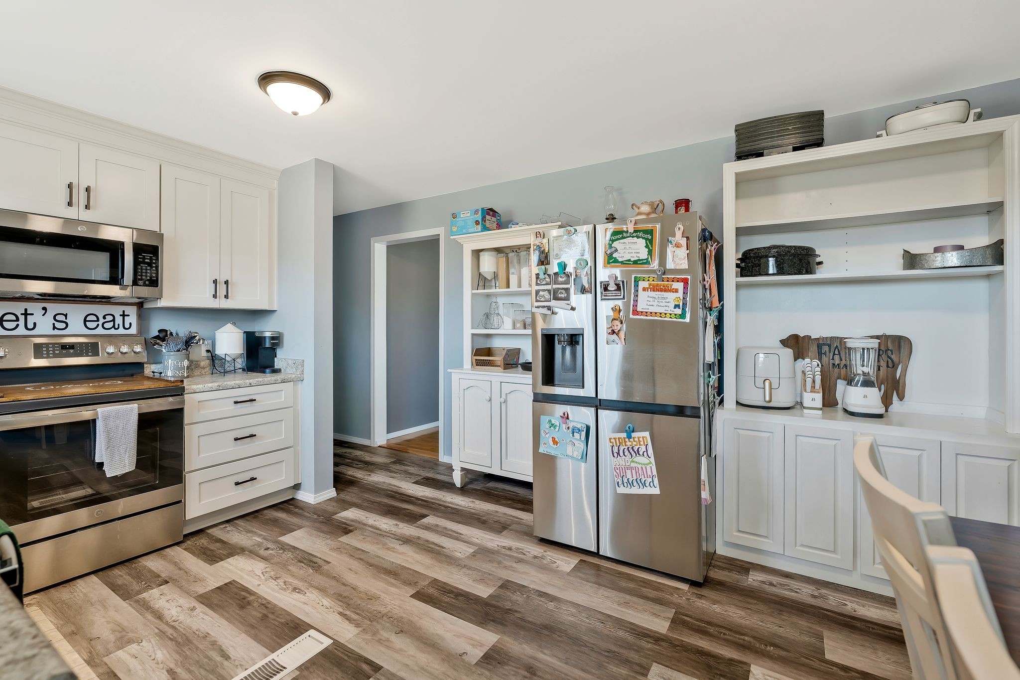 93 Evans Road Five Points, TN 38457 - Photo 22 of 31 a kitchen with stainless steel appliances a refrigerator stove and white cabinets