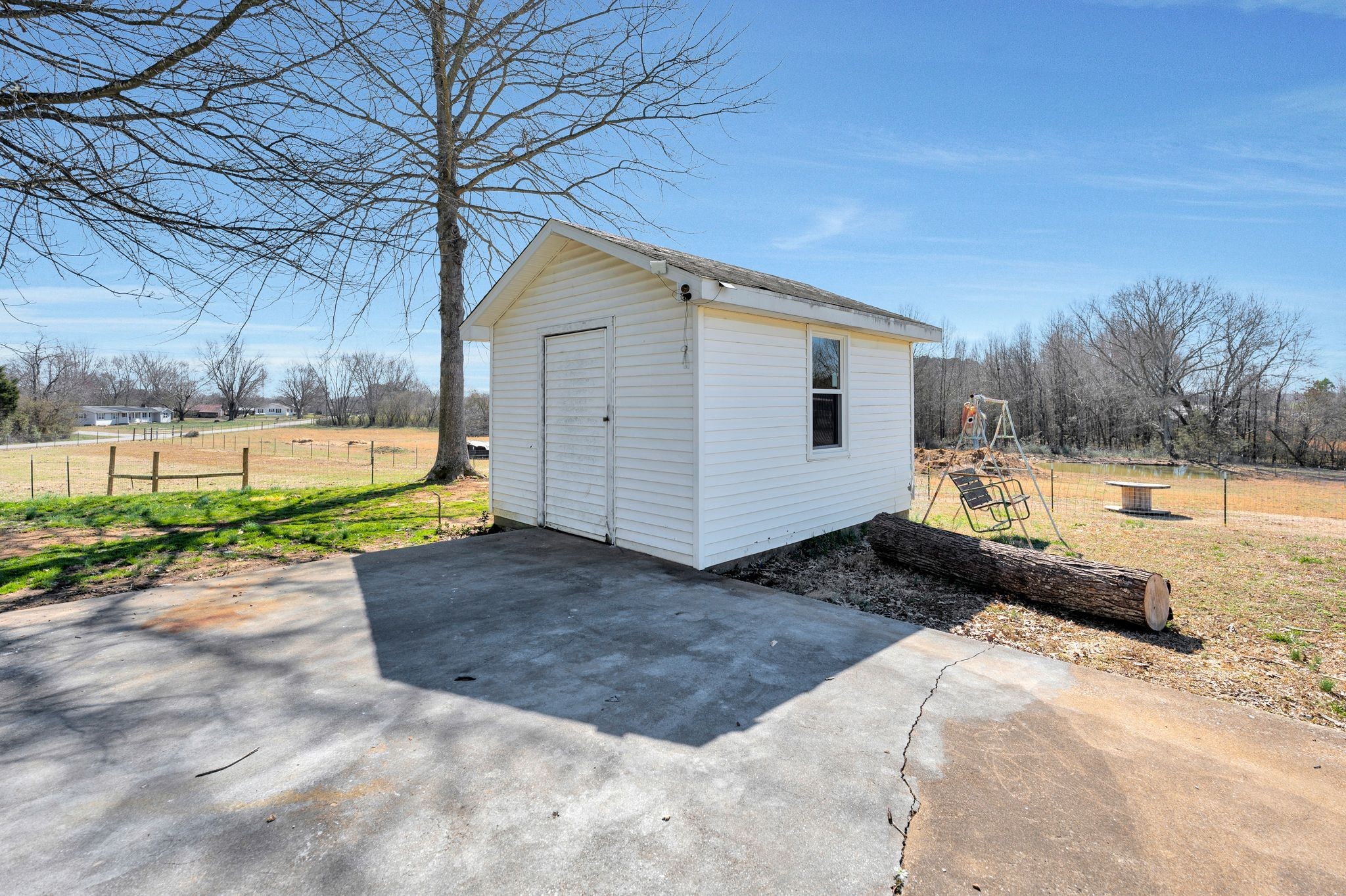 93 Evans Road Five Points, TN 38457 - Photo 25 of 31 a backyard of a house with a yard and garage