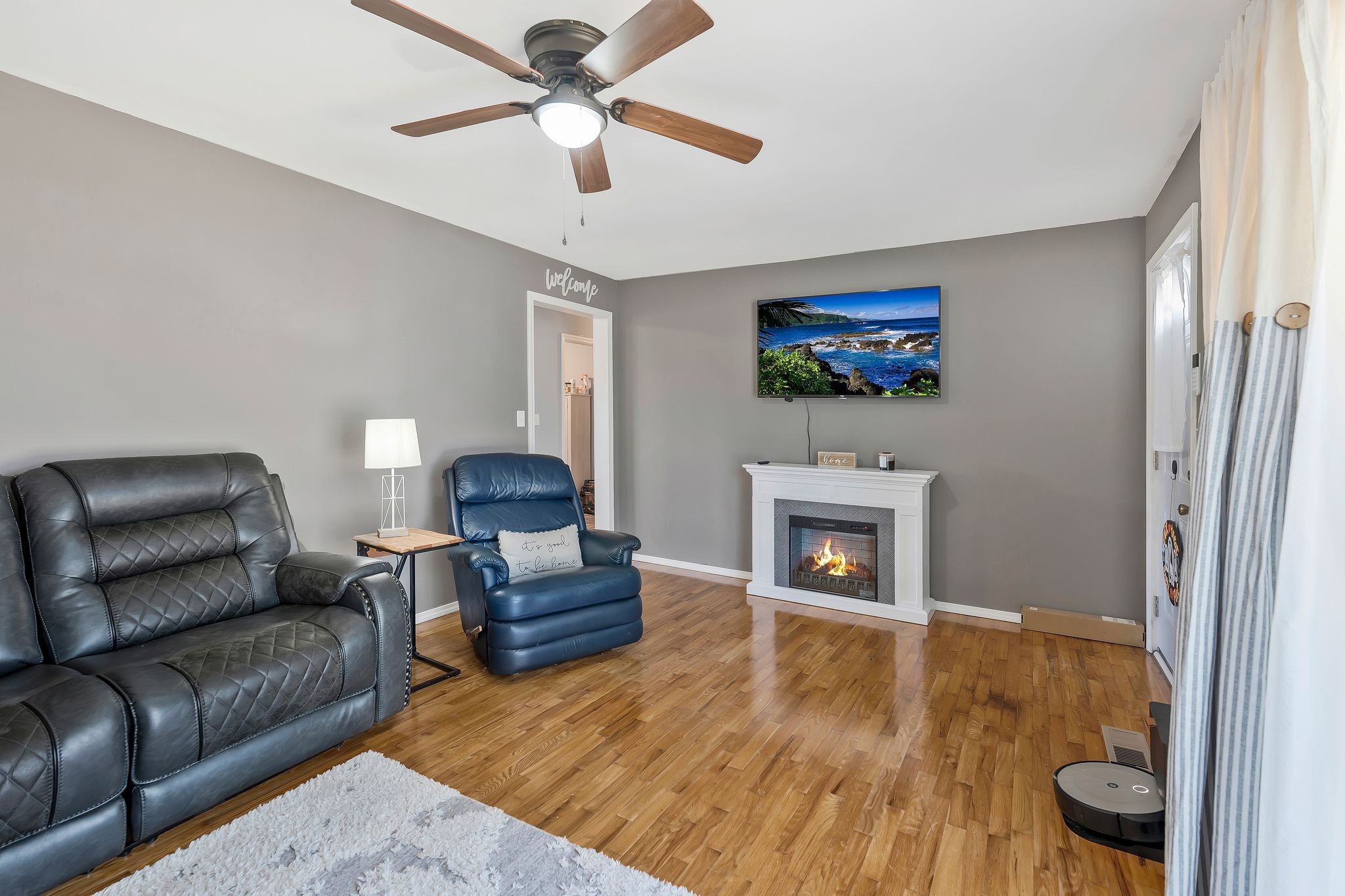 93 Evans Road Five Points, TN 38457 - Photo 5 of 31 a living room with furniture a fireplace and a flat screen tv