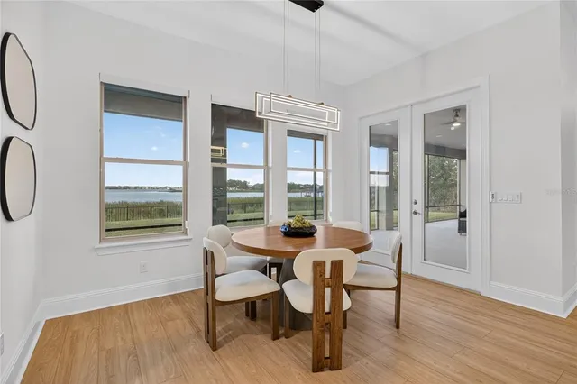 a bedroom with furniture and wooden floor