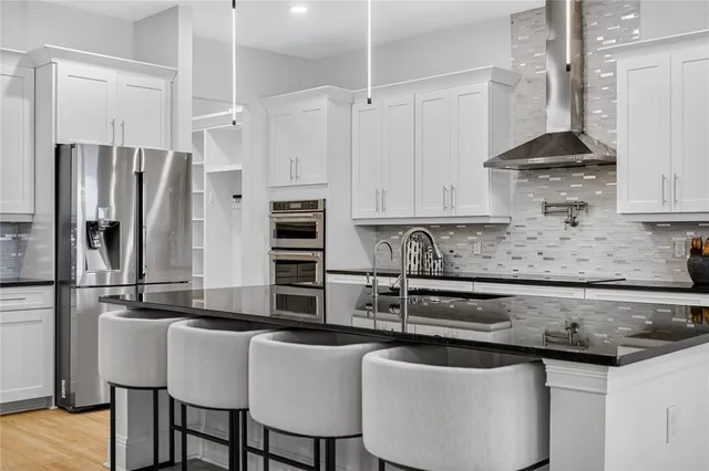 a view of room with window and wooden floor