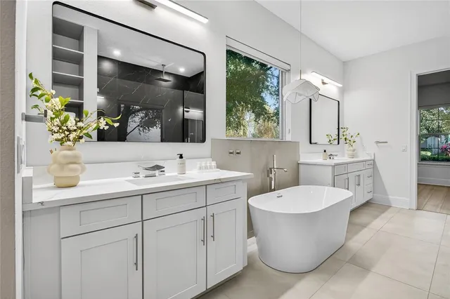 a bathroom with a sink a vanity and a mirror