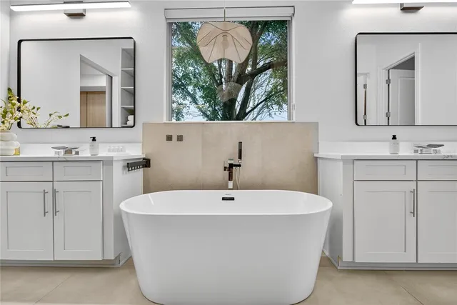 a view of a room with wooden floor and entryway