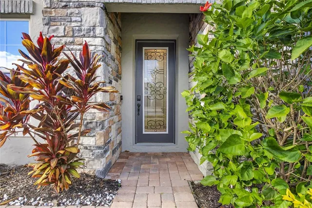 a living room with furniture a rug and a flat screen tv