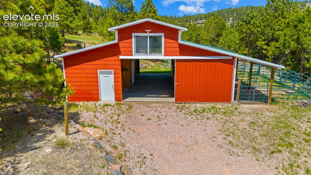 16540 Mesquite Road Peyton, CO 80831 - Photo 42 of 50 a backyard of a house with oven and garden