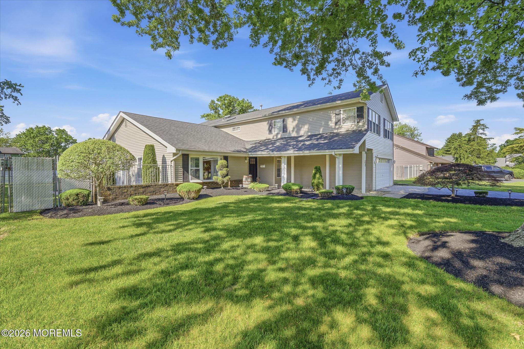 22 Ethan Allen Road Freehold, NJ 07728 - Photo 1 of 31 a front view of a house with a garden