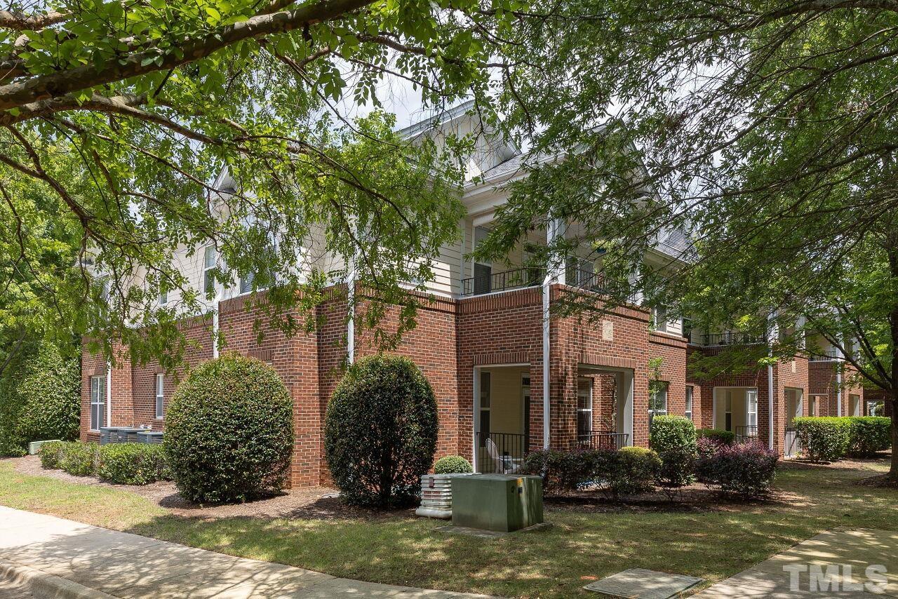 208 West Savannah Ridge Road, Unit 208 Holly Springs, NC 27540 - Photo 1 of 30 a view of a front of a house with a tree