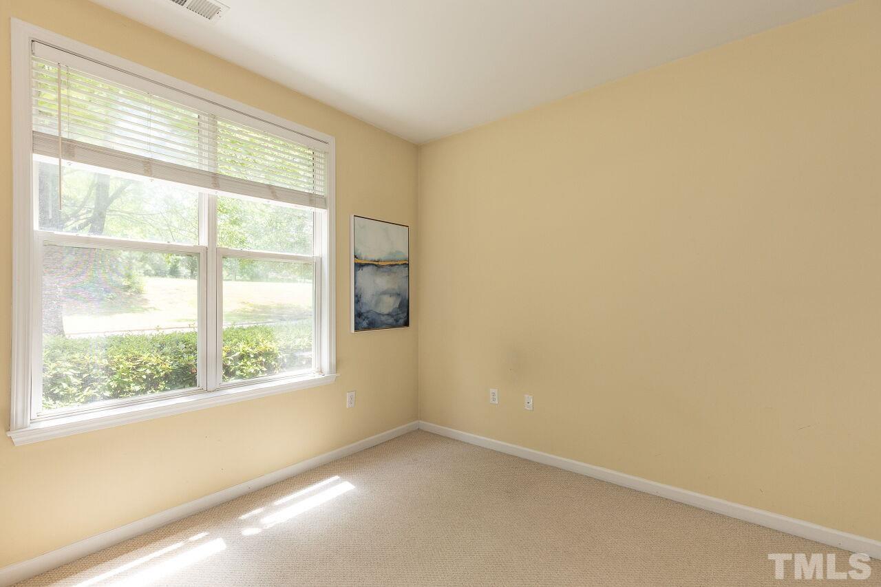 208 West Savannah Ridge Road, Unit 208 Holly Springs, NC 27540 - Photo 15 of 30 a view of an empty room with a window