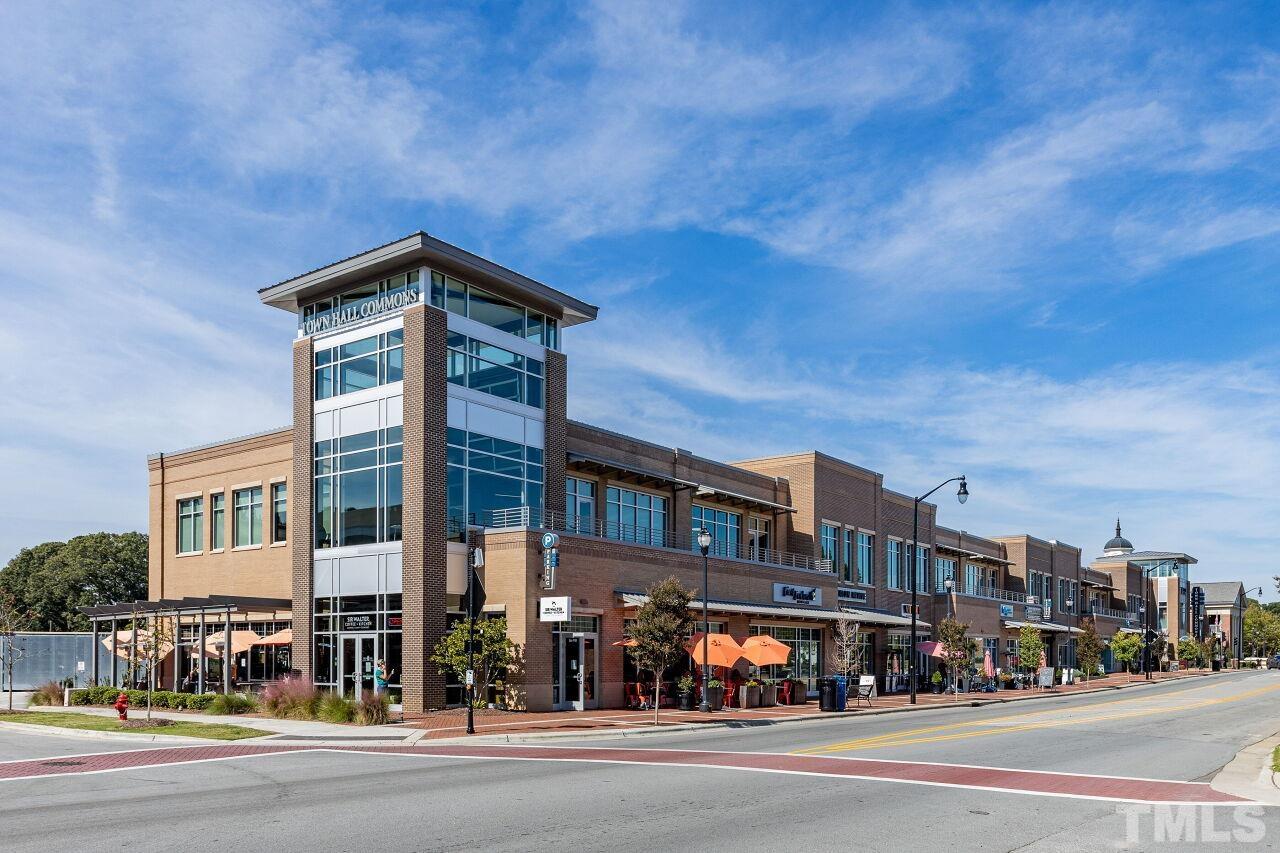 208 West Savannah Ridge Road, Unit 208 Holly Springs, NC 27540 - Photo 24 of 30 a view of a building and a street