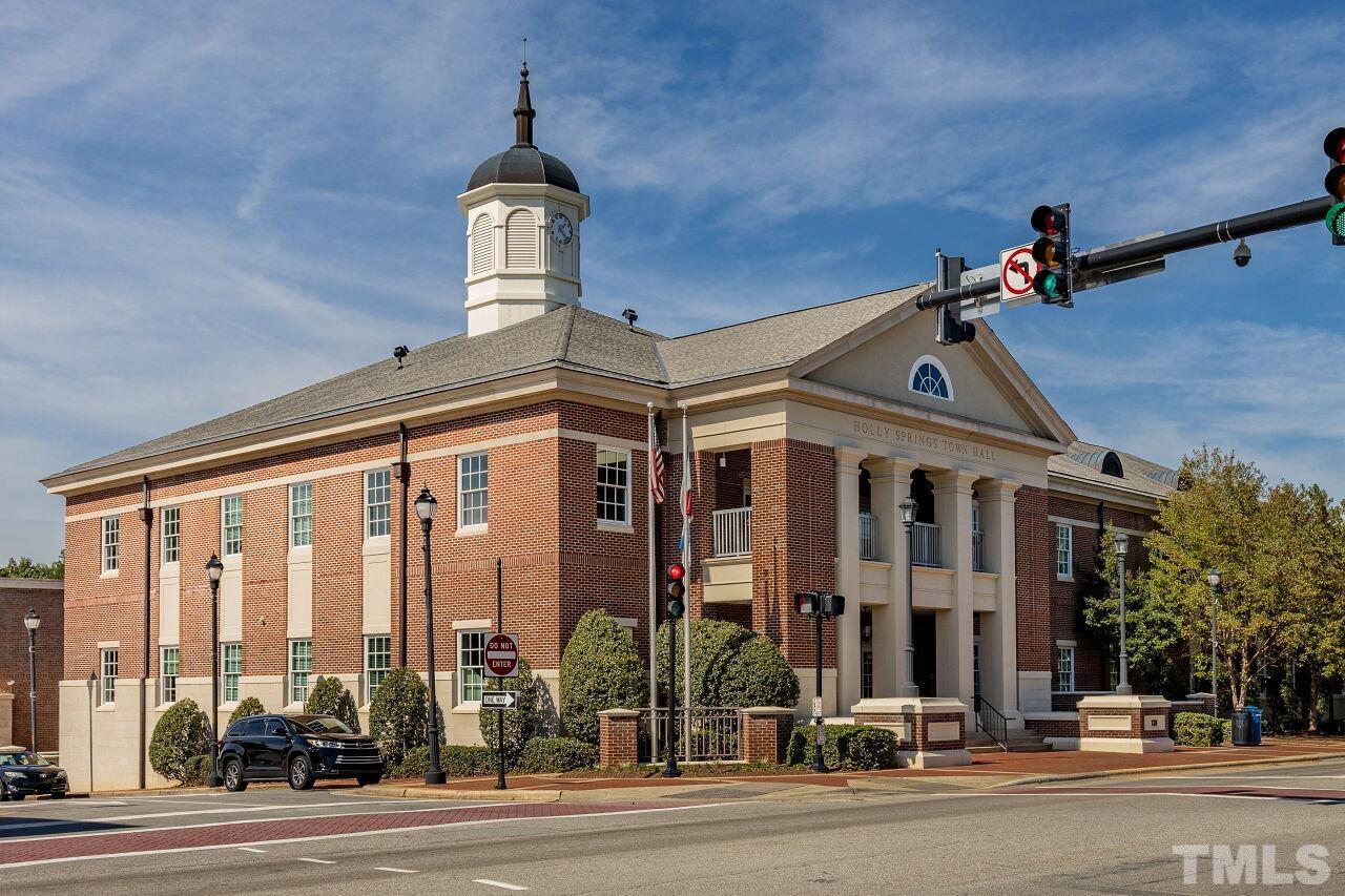 208 West Savannah Ridge Road, Unit 208 Holly Springs, NC 27540 - Photo 25 of 30 a view of a building with a street