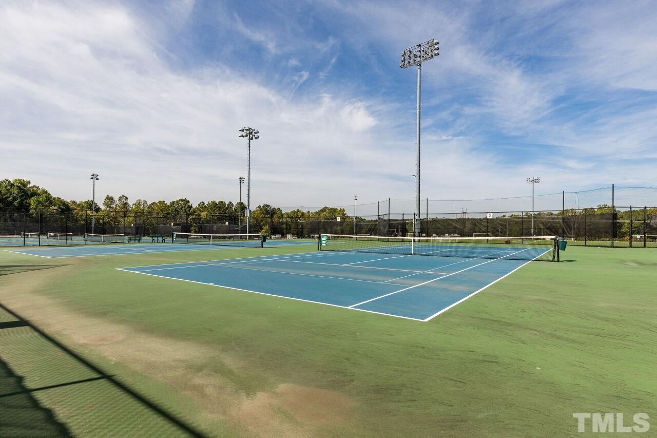 208 West Savannah Ridge Road, Unit 208 Holly Springs, NC 27540 - Photo 29 of 30 a view of a tennis court