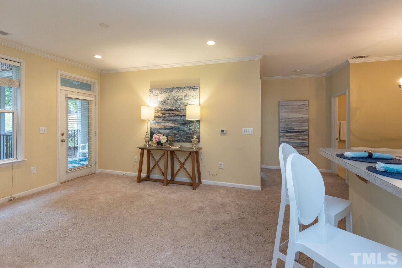 208 West Savannah Ridge Road, Unit 208 Holly Springs, NC 27540 - Photo 6 of 30 a workspace with furniture and window