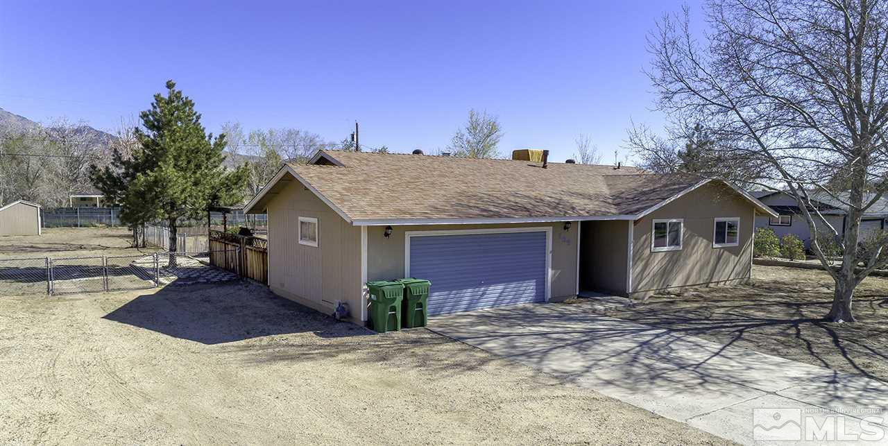 165 Ring Road Dayton, NV 89403 - Photo 1 of 19 a front view of a house with a yard