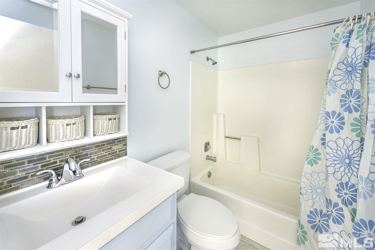 165 Ring Road Dayton, NV 89403 - Photo 13 of 19 a bathroom with a sink toilet tub and shower