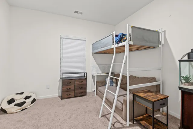 a view of room with furniture and ceiling fan