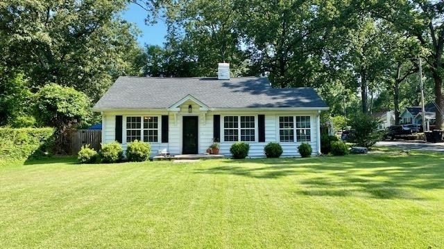 200 Oakwood Street Northwest Rome, GA 30165 - Photo 1 of 1 a front view of a house with a yard