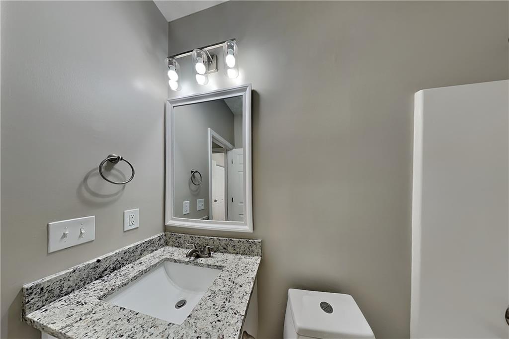 274 Windcroft Lane Northwest Acworth, GA 30101 - Photo 12 of 16 a bathroom with a sink a large mirror and a shower
