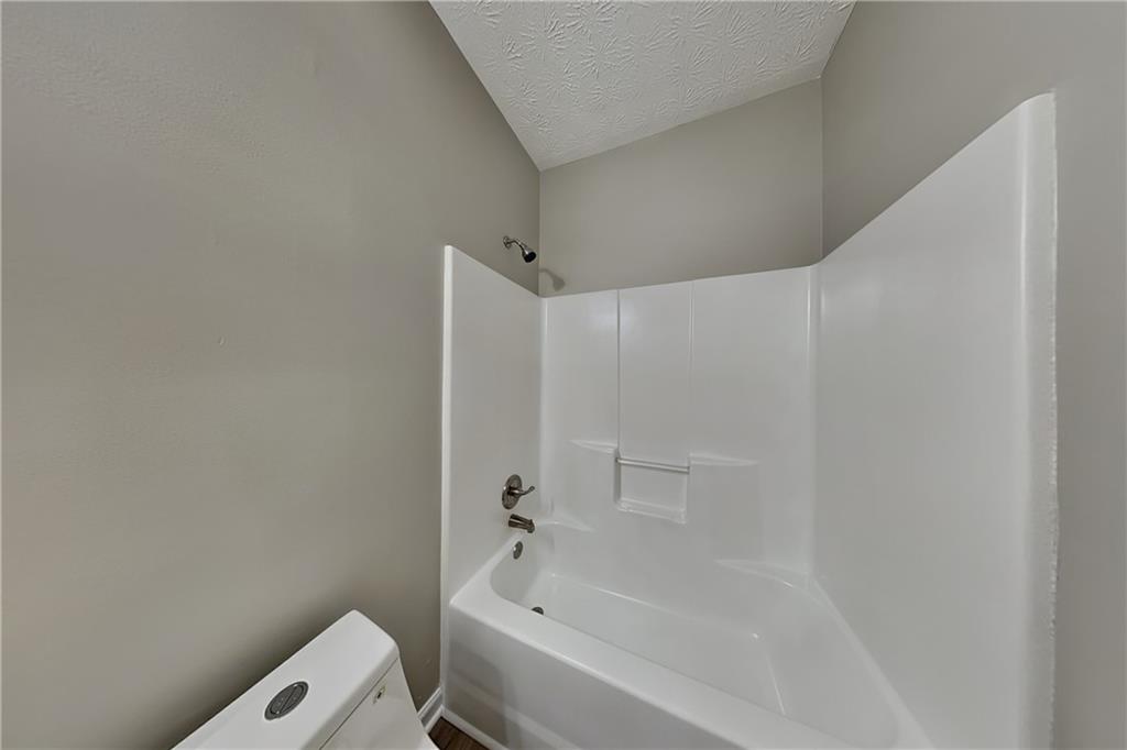 274 Windcroft Lane Northwest Acworth, GA 30101 - Photo 13 of 16 a bathroom with a bathtub and toilet