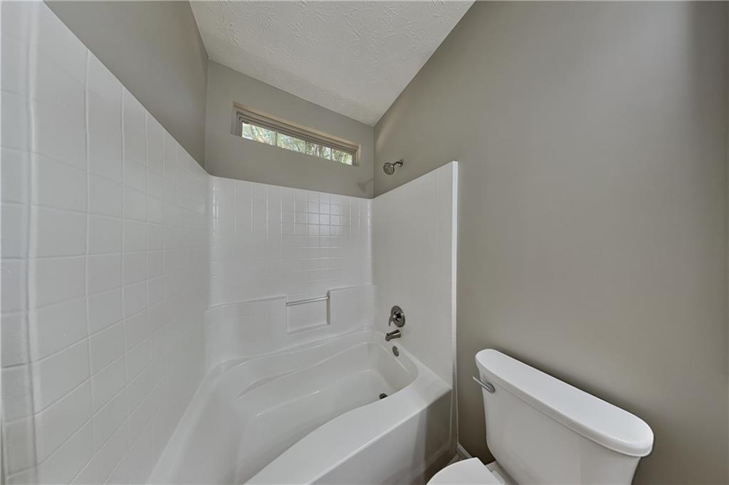 274 Windcroft Lane Northwest Acworth, GA 30101 - Photo 7 of 16 a bathroom with a toilet and bathtub