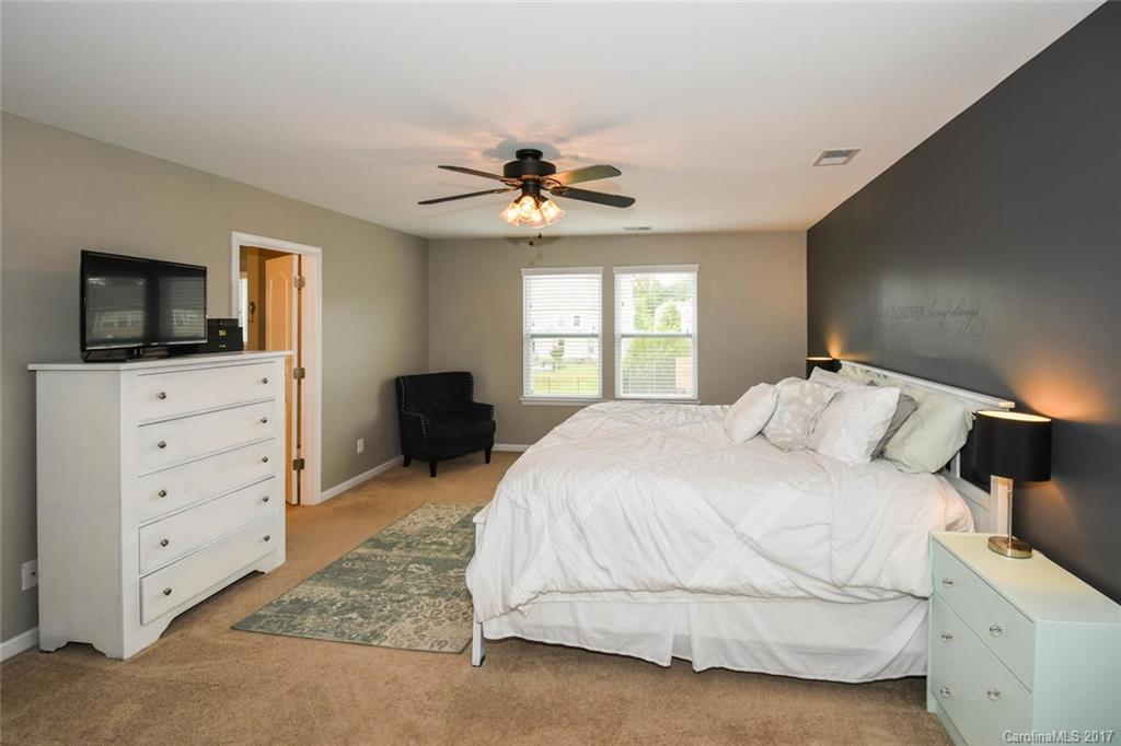 79457 Ridgehaven Road Lancaster, SC 29720 - Photo 13 of 24 a bedroom with a bed and a flat screen tv