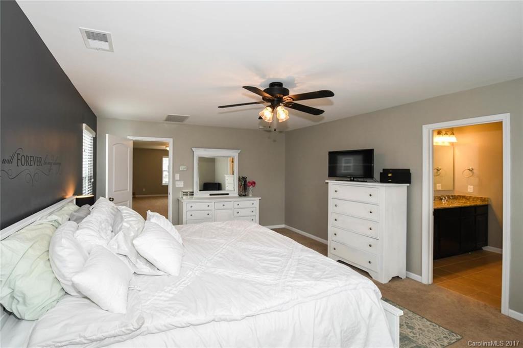 79457 Ridgehaven Road Lancaster, SC 29720 - Photo 14 of 24 a bedroom with a bed and a flat screen tv