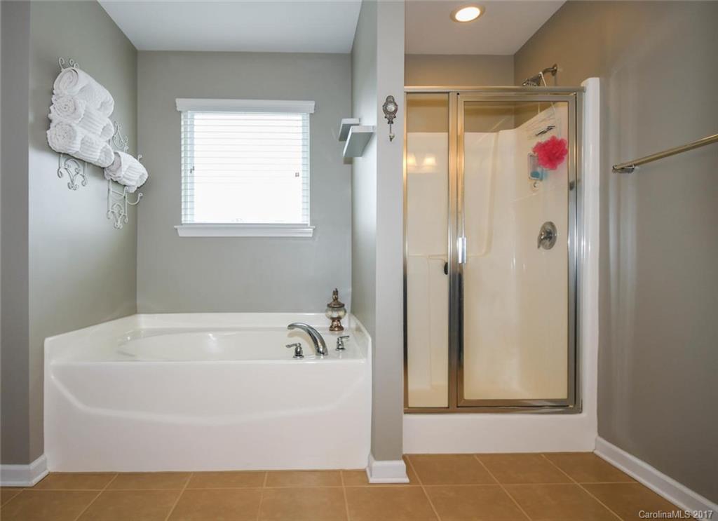 79457 Ridgehaven Road Lancaster, SC 29720 - Photo 17 of 24 a white bath tub sitting next to a shower